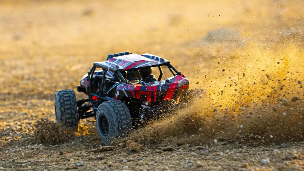 RC buggy throwing dust at speed